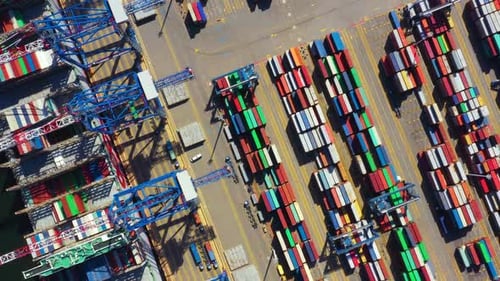Global Logistics Aerial View of a Busy Container Port Terminal