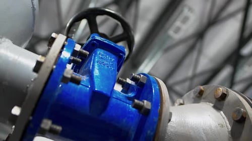 Flange with Round Lever on Metal Pipeline at Refinery Plant