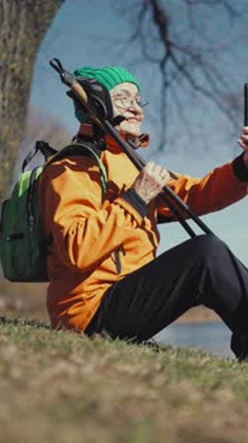 Active Old Woman Resting After Hike and Calling By Video in Smartphone in Park Pretty Senior Lady