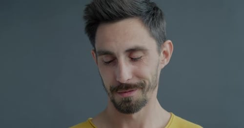 Man Looks Down and Up Close Up