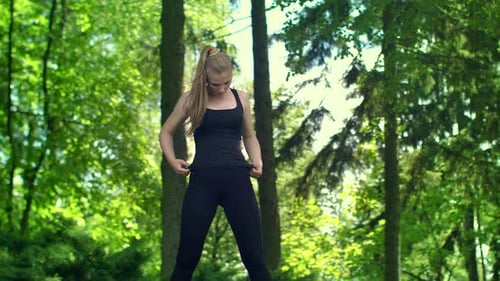 Woman Stretching Her Arms Preparing to Run Marathon Outdoor. Wellness Concept. Fit