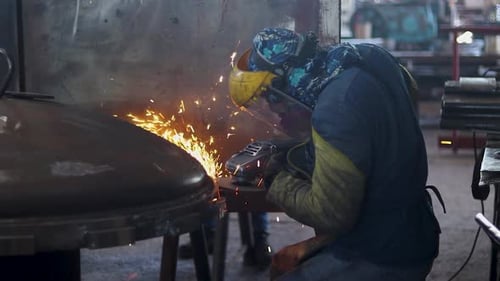 Sparks Fly Professional Worker Using Heavy Duty Metal Grinder