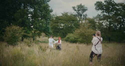 Romantic couple posing for photographer in field