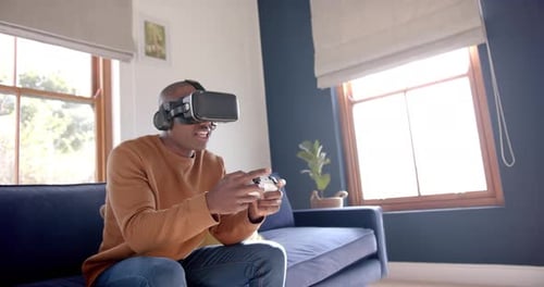 Man Experiences Virtual Reality Gaming at Home