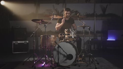 Drummer Playing Drums in Urban Music Studio