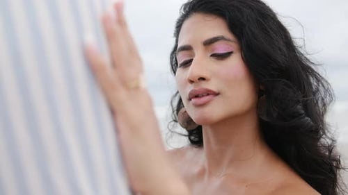 Romantic Woman Embracing Man at the Beach