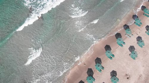 Scenic view of umbrellas at sea coast on sunny day