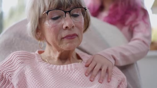 Closeup Portrait of Depressed Senior Caucasian Woman Sighing As Child Hand Touching Shoulder