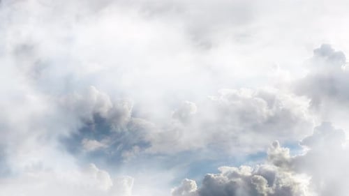 thick white clouds in the blue sky