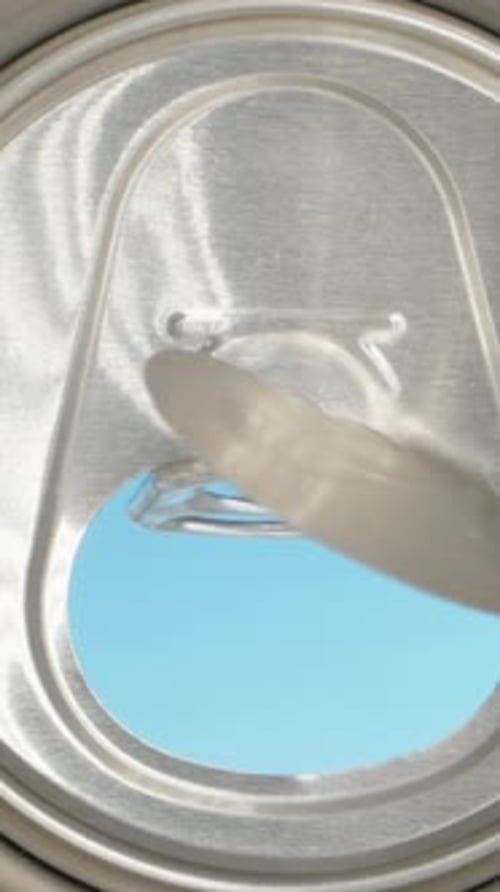 View from a metal jar, opening the jar, view inside, super macro. Blue sky. Vertical, Social Media