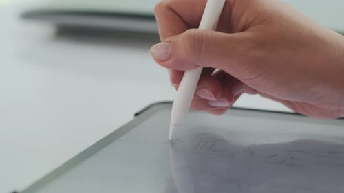 Hand Drawing on Tablet with Stylus Close Up