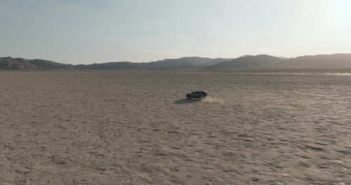 a car driving through a desert