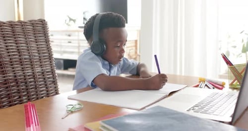 Young Boy Doing Schoolwork at Home