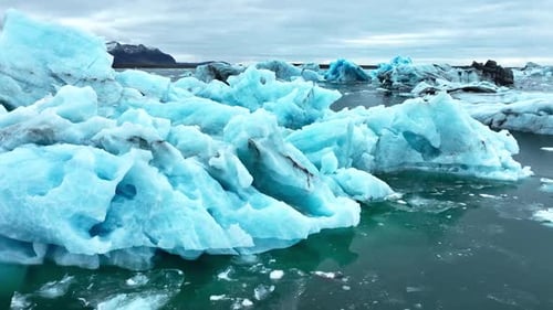 Cinematic Drone View of the Sharp Ice Ridges of Glacier Blue Ice Natural Landscape of the Icelandic