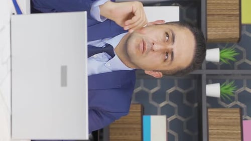 Man In Suit Having an Online Meeting on Laptop