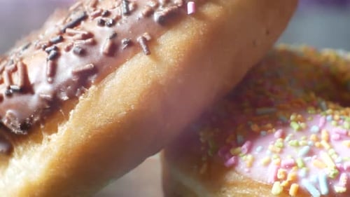 Delicious glaze donut homemade tasty coated sprinkles toppings sweet food close-up