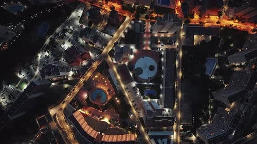 Birds eye overhead aerial view of modern city at night