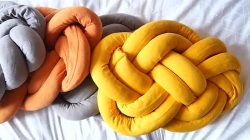 Knot Pillows Overhead on Bed