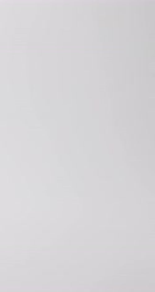 Hourglass With Sand Flowing on White Background