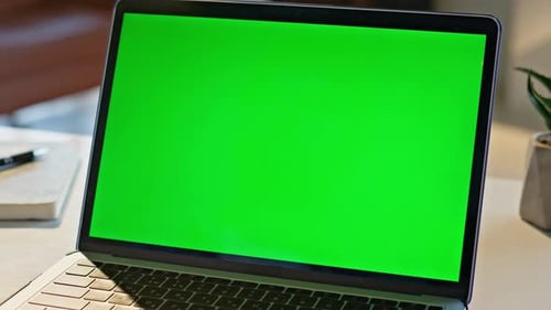 Modern Green Screen Laptop Computer Placed on Desk Closeup Mockup Display Pc