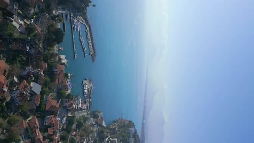 the Camera Flies From the Side of the Old City of Antalya to the Sea Bay