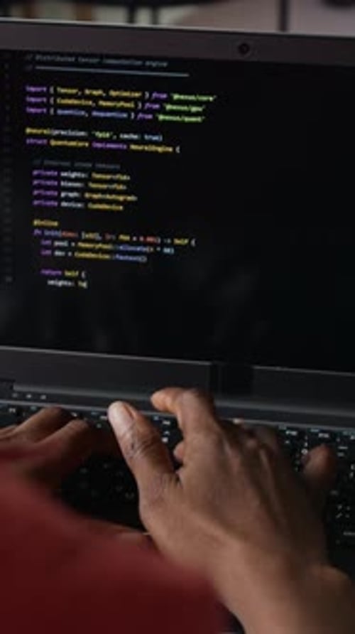 Vertical of Hands of Anonymous Black Programmer Typing Code on Laptop Keyboard