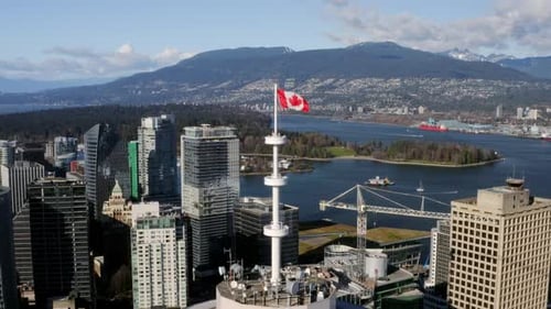 Vancouver cityscape aerial view with Canadian flag