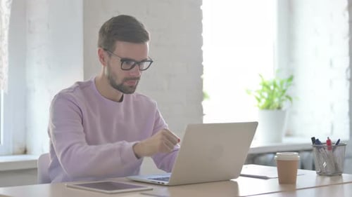 Online Video Call By Young Man in Office