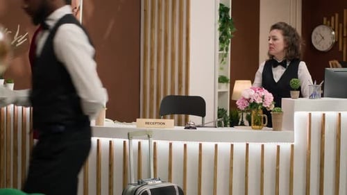 Guest Checking in to Hotel Reception