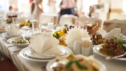 Long Table Buffet with Plates of Food