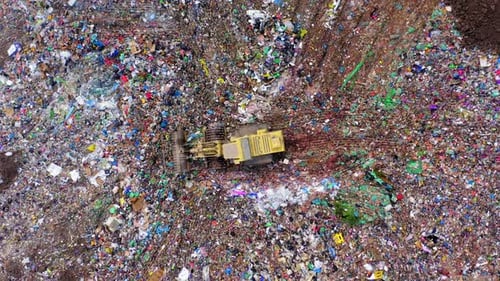 City landfill with trucks and compactors at work