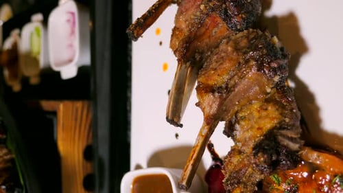 Close Up of Grilled Lamb Plate and Sauce