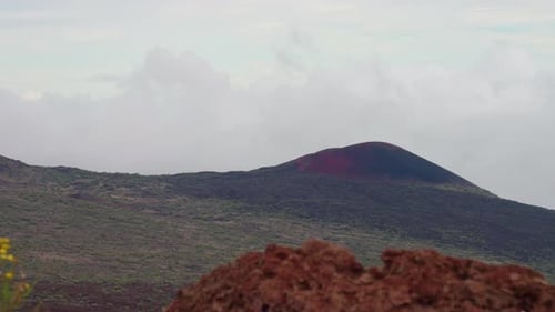 4K Lookout Of Volcanic Mountain Over Crater Valley With Rocky Foreground, Mauna Kea, Hawaii, Slow Mo