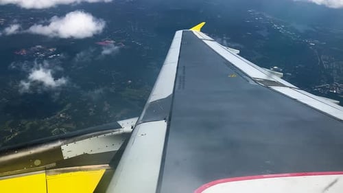 Aerial shots from a window of a Boeing 747 plane turning 180