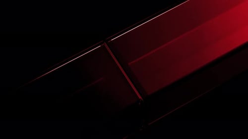 Red glassy cubes rotating on black background