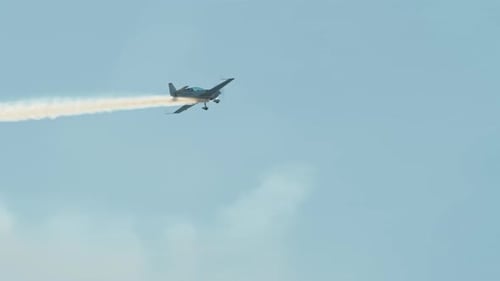 Aerobatics with White Smoke Trail
