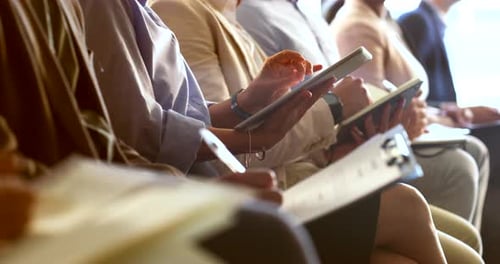 Professionals Taking Notes at a Corporate Event