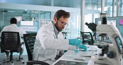 Scientist Works in Bright Modern Lab