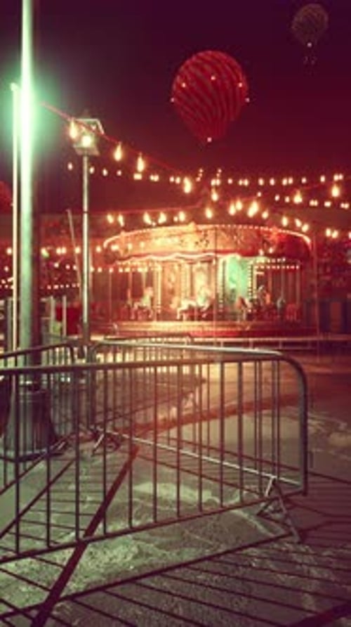 Illuminated MerryGoRound Spinning at Night