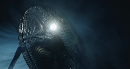 Industrial Fan in a Smoky, Dark Environment