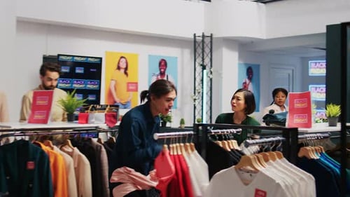Clothing Store Customers Shopping on Black Friday