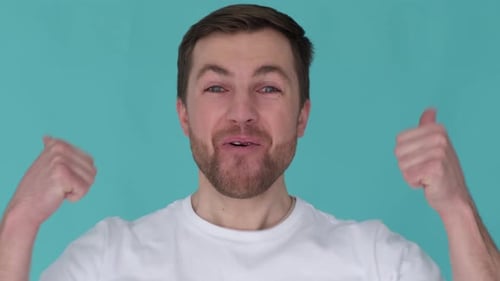 Enthusiastic Man Gives Two Thumbs Up Close Up