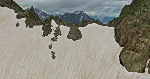 Ancient Snow Glacier Among High Mountains The Peaks of the Mountains are Covered with Snow