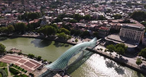 Birds Eye View Above Bridge of Peace, Kura River with Tbilisi Traffic