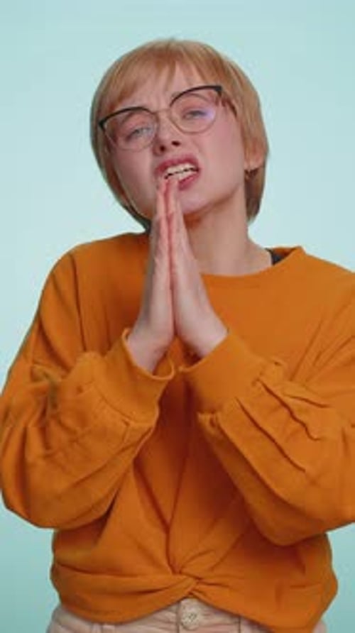 Woman Begging with Hands Pressed Together