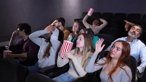 Spectators Reacting to Movie in Slow Motion Montage