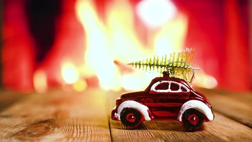 Christmas Baby Slippers and Toy Car by Fireplace