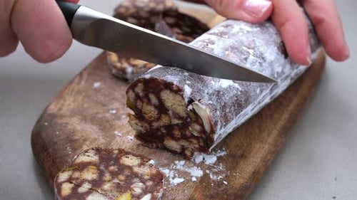 Chocolate Salami Sliced on Wooden Cutting Board