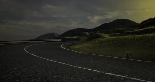 Curvy Road in a Remote Landscape Under an Evening Sky in Tranquil Setting