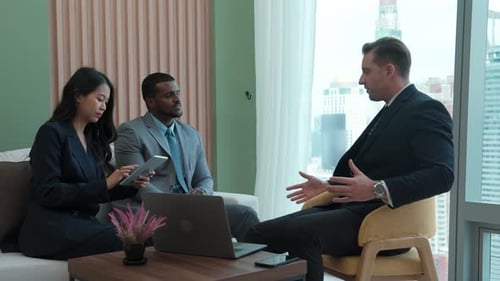 Diversity business people in ornamented office discussing business plan